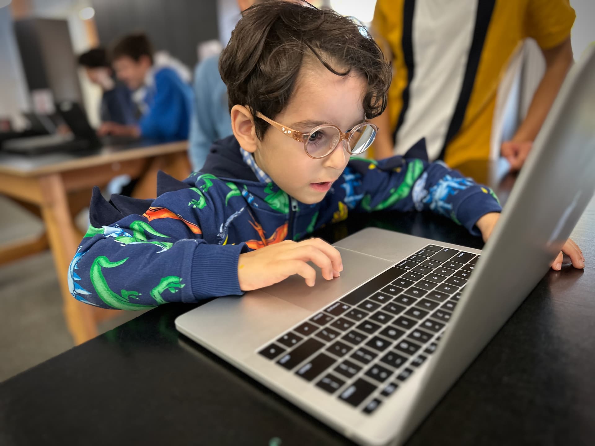 A child creating a coding project at TinkerTank