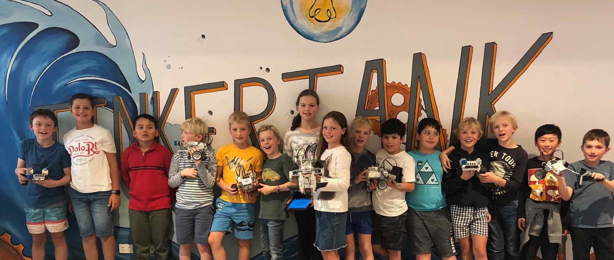 TinkerTank students proudly showing projects they built